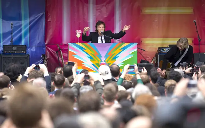 Paul McCartney playing his custom piano in Covent Garden in 2013
