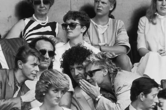 David Bowie, Roger Taylor and Brian May chatting during the Live Aid Concert at Wembley Stadium