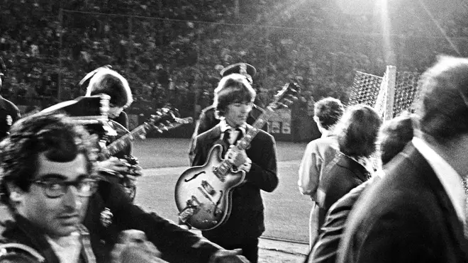 George Harrison and The Beatles leave the stage