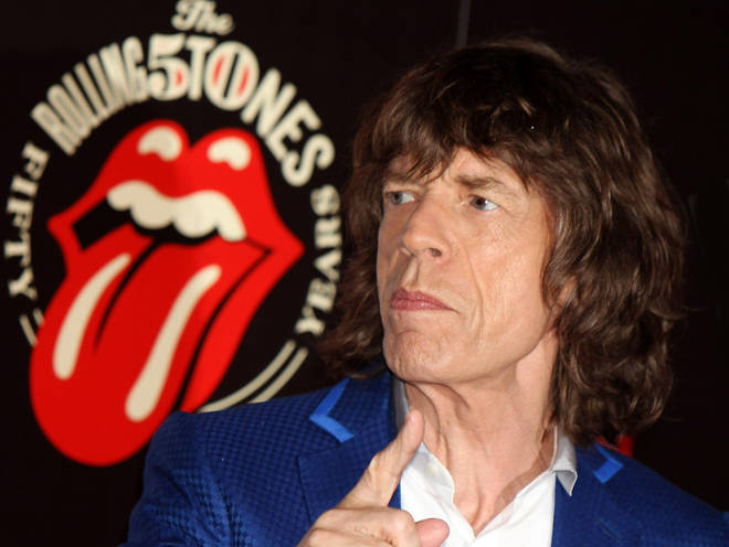 Mick Jagger with the 50th anniversary tongue and lips logo
