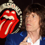 Mick Jagger with the 50th anniversary tongue and lips logo