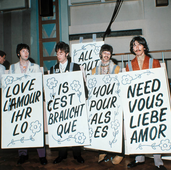 The Beatles with their 'All You Need Is Love' placards