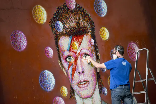 The David Bowie mural in Brixton, South London being painted by Jimmy C in 2013