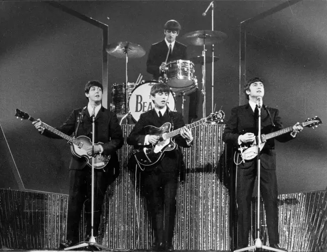 The Beatles on stage at the London Palladium in 1963 as Beatlemania was well under way. (Photo by Michael Webb/Getty Images)
