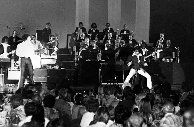 Elvis Presley pulling karate moves on stage with Tom Jones in 1974.