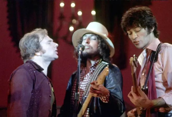 The Band's Robbie Robertson performing alongside Bob Dylan and Van Morrison at their farewell concert, The Last Waltz. (Photo by Larry Hulst/Michael Ochs Archives/Getty Images)