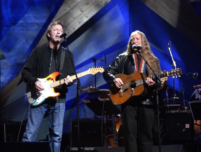 Eric Clapton and Willie Nelson performing together in 2003. (Photo by KMazur/WireImage)