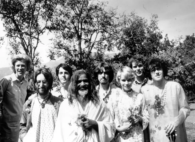 The Beatles in India with Donovan (far right), Mia Farrow, and the Maharishi Mahesh Yogi in 1968. (Photo by Keystone Features/Hulton Archive/Getty Images)