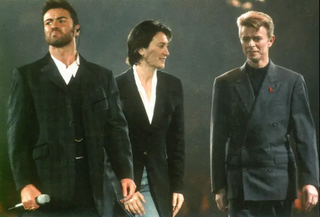 David Bowie introduced George Michael before he took London's Wembley Arena stage at the Concert Of Hope in 1993. (Photo by Pete Still/Redferns)