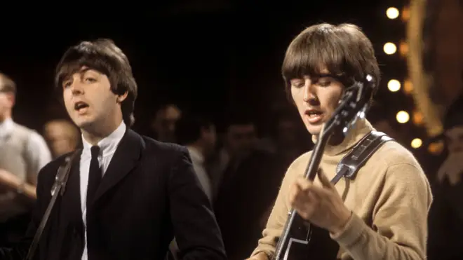 Paul McCartney (playing a Hofner 500/1 violin bass guitar) and George Harrison (playing a Gretsch 6119 Tennessean guitar with Bigsby vibrato)